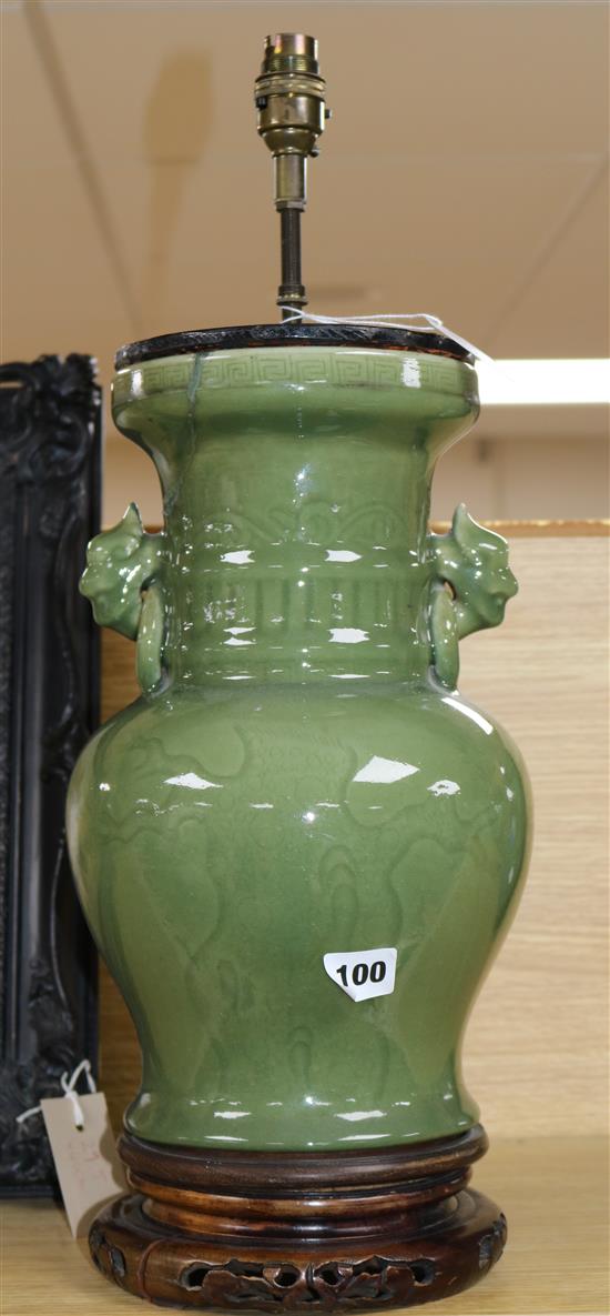 A Chinese celadon green glazed lamp